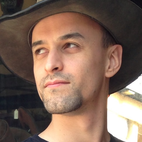 Adam in a Renfaire cowboy hat